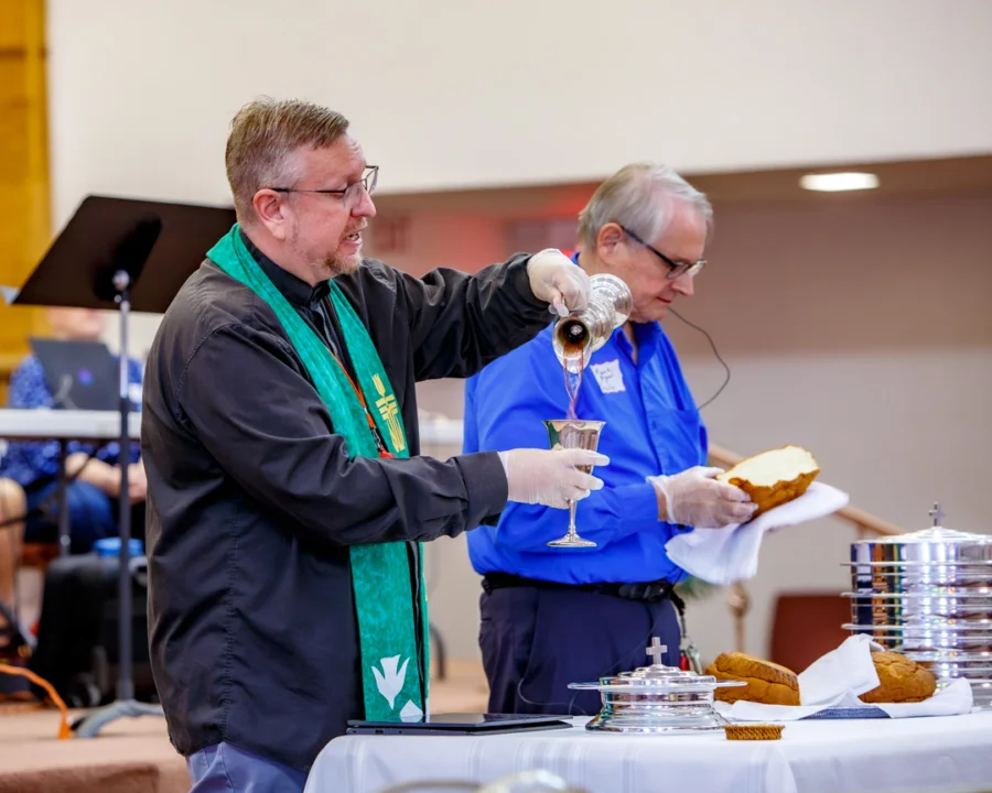Tony Larson administers communion.