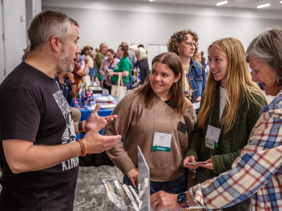 Adam Walker Cleaveland of Illustrated Ministry chats with the interns at the Presbyterian Outlook during the Town Square at the 227th General Assembly.