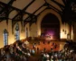 A sanctuary with people in it