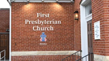 A brick wall that says First Presbyterian Church.
