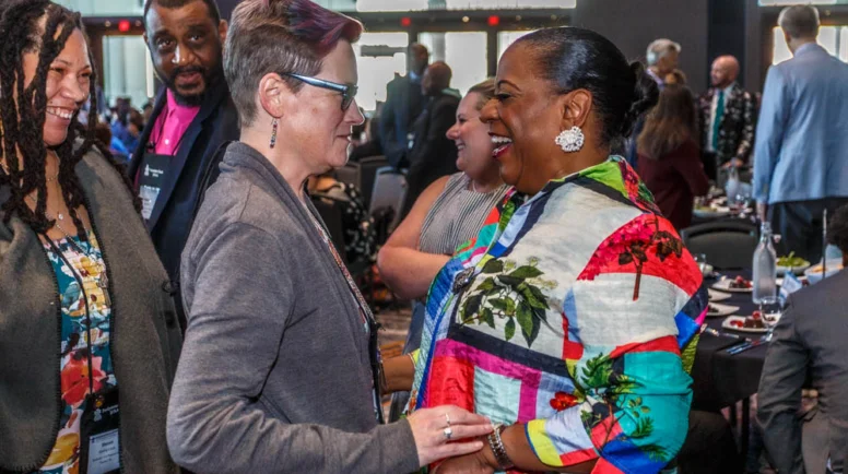 Two women embrace