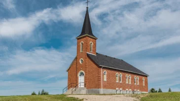 Blue sky and clouds over St. John’s Lutheran Church in Edenwold, near Regina, SK