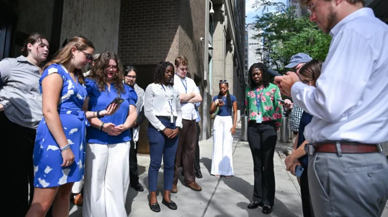 A group of young adults on the street of New York City as they pray for the United Nations during the High-level Political Forum on Sustainable Development.