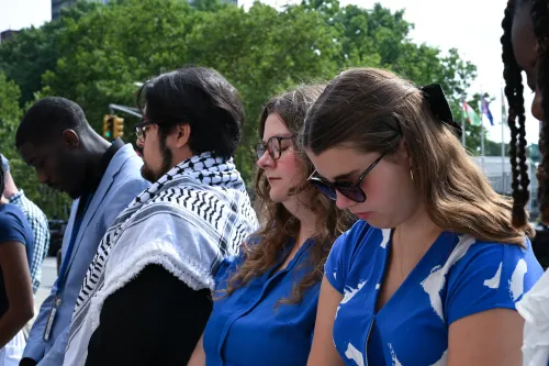 A group of Presbyterian young adults pray.