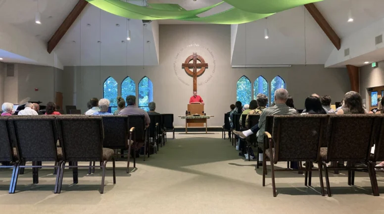 People sit in the sanctuary of Tualatin Presbyterian Church in Tualatin, Oregon.