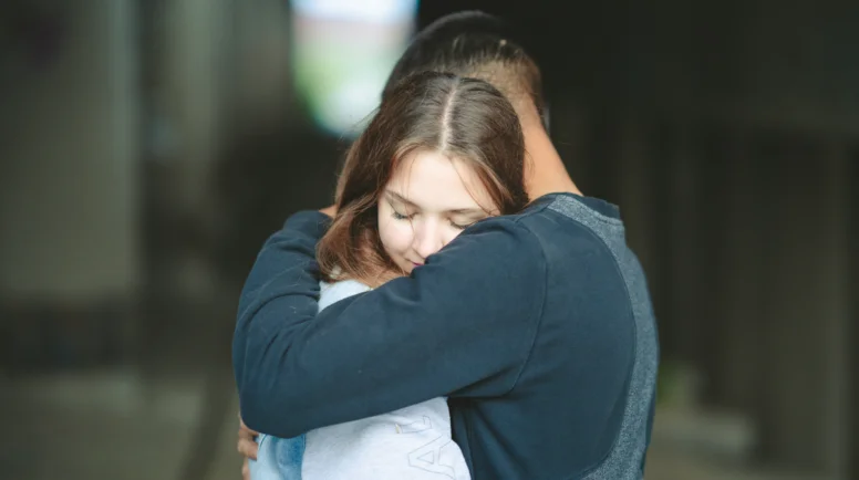 Father and daughter hugging eachother