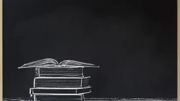 Black chalkboard frame with stacked and open books