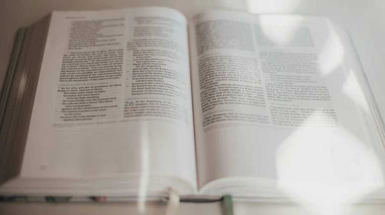 Open bible with light shining on it.