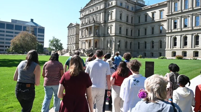 A group of young adults walking outside