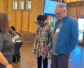The Rev. Marta Pumroy-Cordero stands before Board Co-Chairs Aleathea Harris-Little & the Rev. Scott Lumsden
