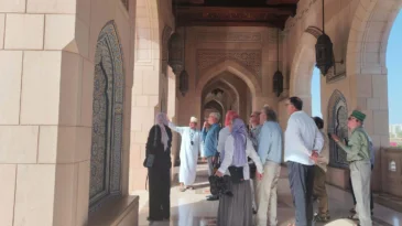Visitors are shown the Grand Mosque in Abu Dhabi.