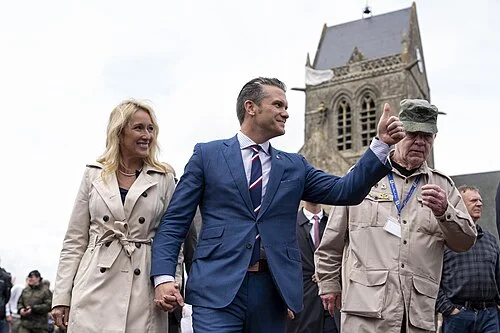 Pete Hegseth and his wife Jennifer in front of church