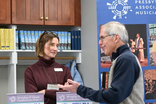 PAM Executive Director Kelly Abraham speaks to a workshop attendee during the Presbyterian Association of Musicians' Come Sunday Event in February 2026.