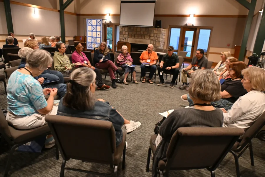 People sit in a large circle at the 2026 Atwood Institute for Congregational Courage 
