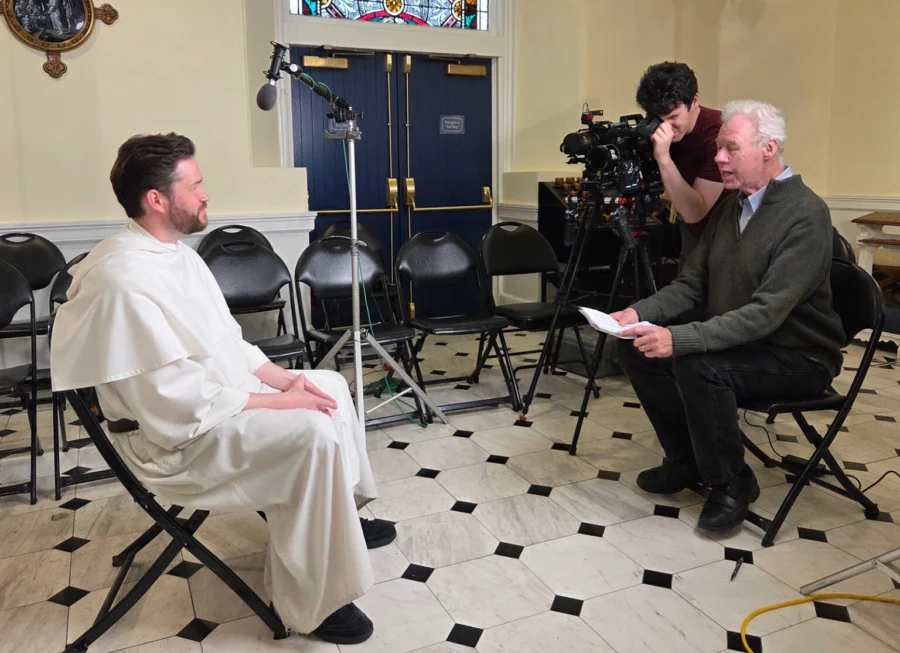 Filmmaker Martin Doblmeier, right, interviews Father Jonah Teller, OP, Vicar of St. Joseph's Church New York. (Photo by Journey Films)